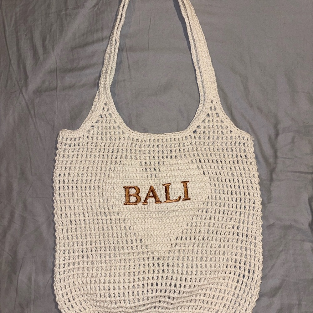 Cream crochet Bali bag with gold lettering